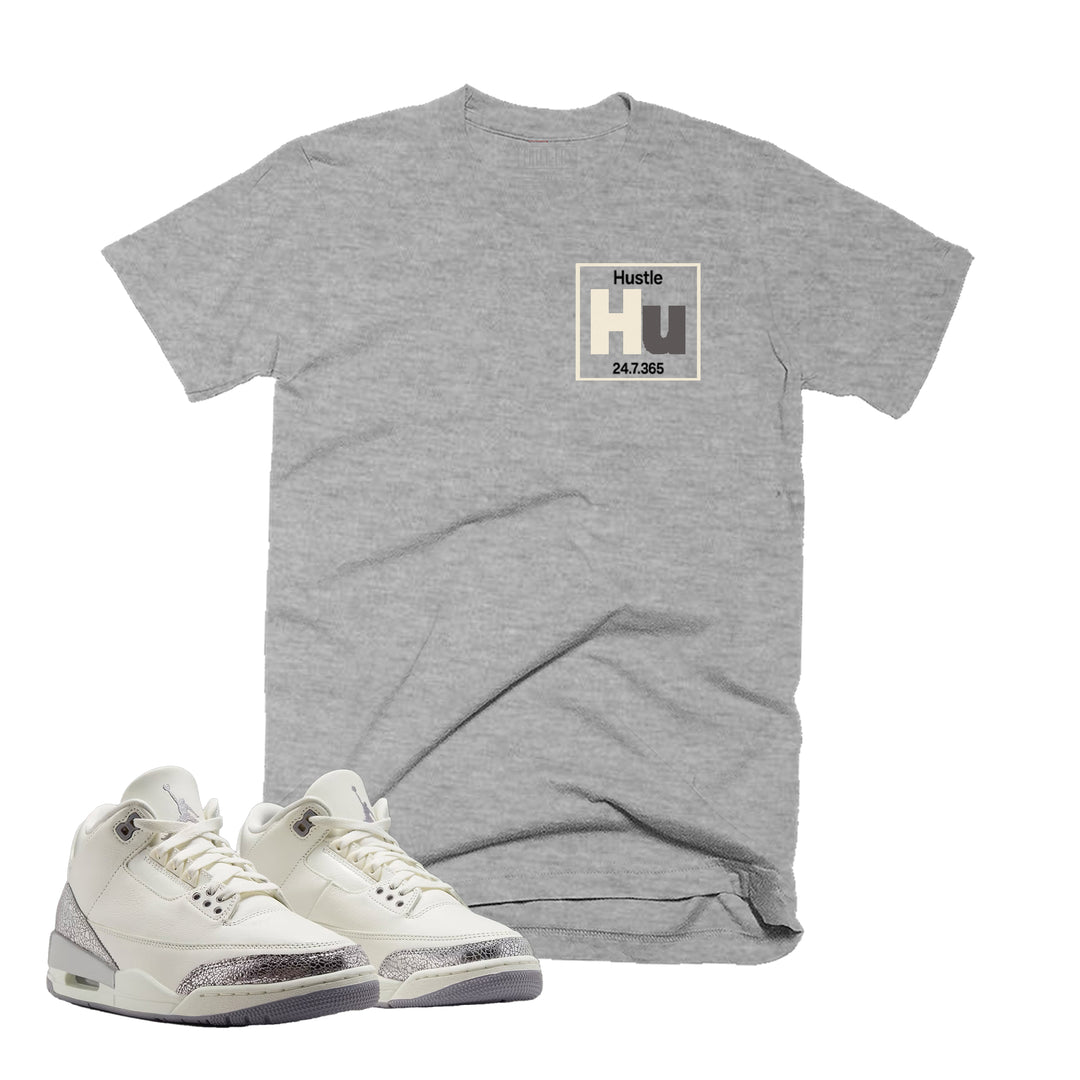 Heather Grey T-shirt with an Hustle design on the front