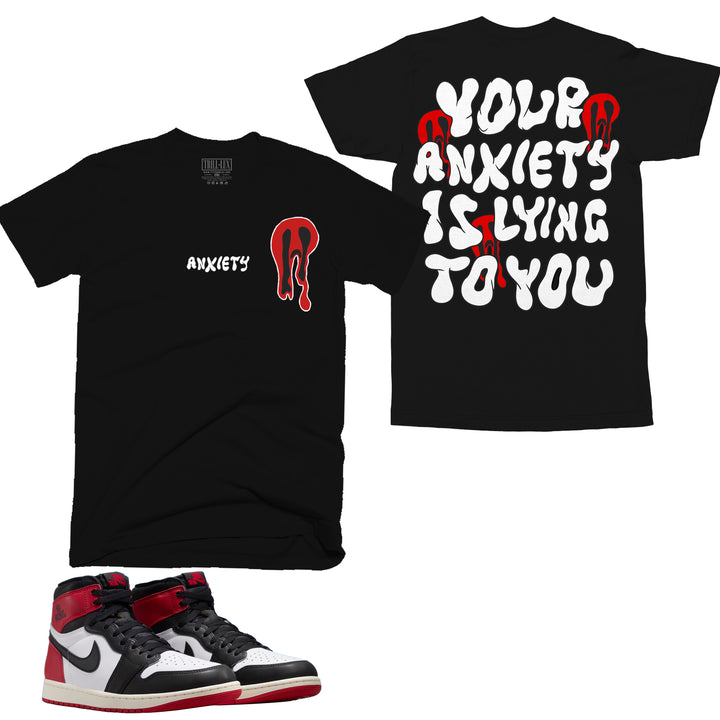 black T-shirt with an anxiety ghost design on front and back that reads your anxiety is lying made to match jordan 1 black toe Reimagined shoes