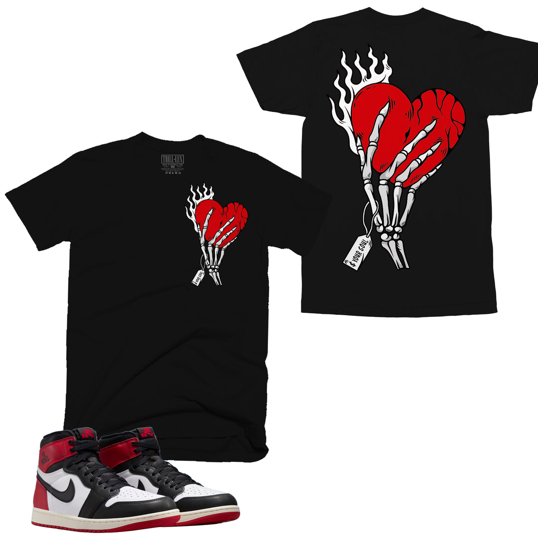 black T-shirt with an bone hand holding a red heart design on front and back made to match jordan 1 black toe Reimagined shoes