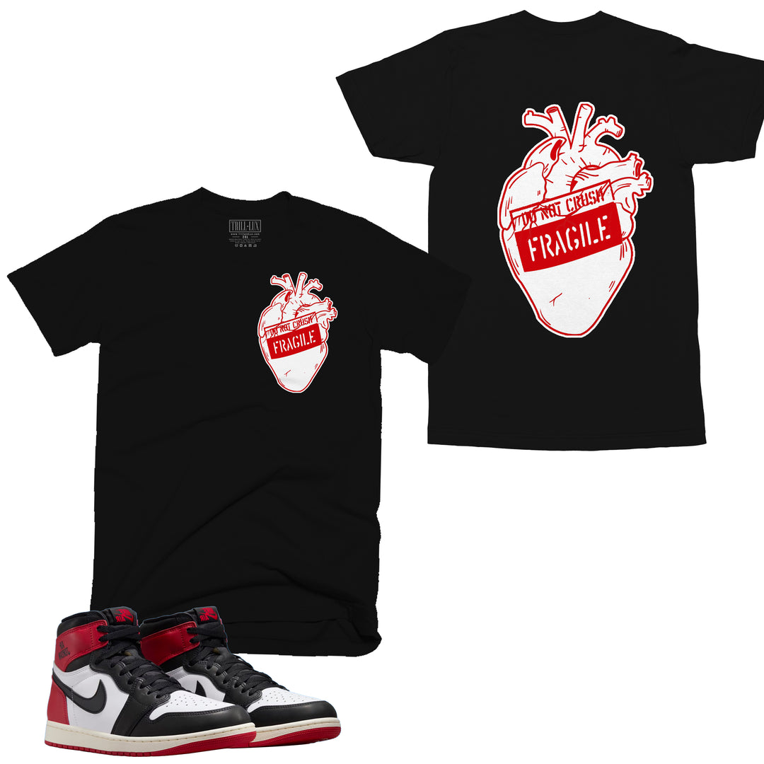 black tshirt with a heart marked fragile design on front and back made to match jordan 1 black toe Reimagined shoes