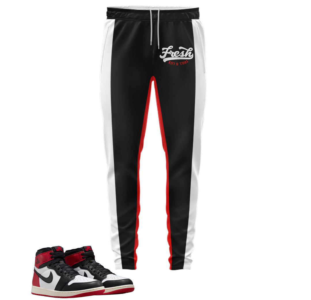 black jogger with fresh on front with color block stripes down the side made to match jordan 1 black toe Reimagined shoes