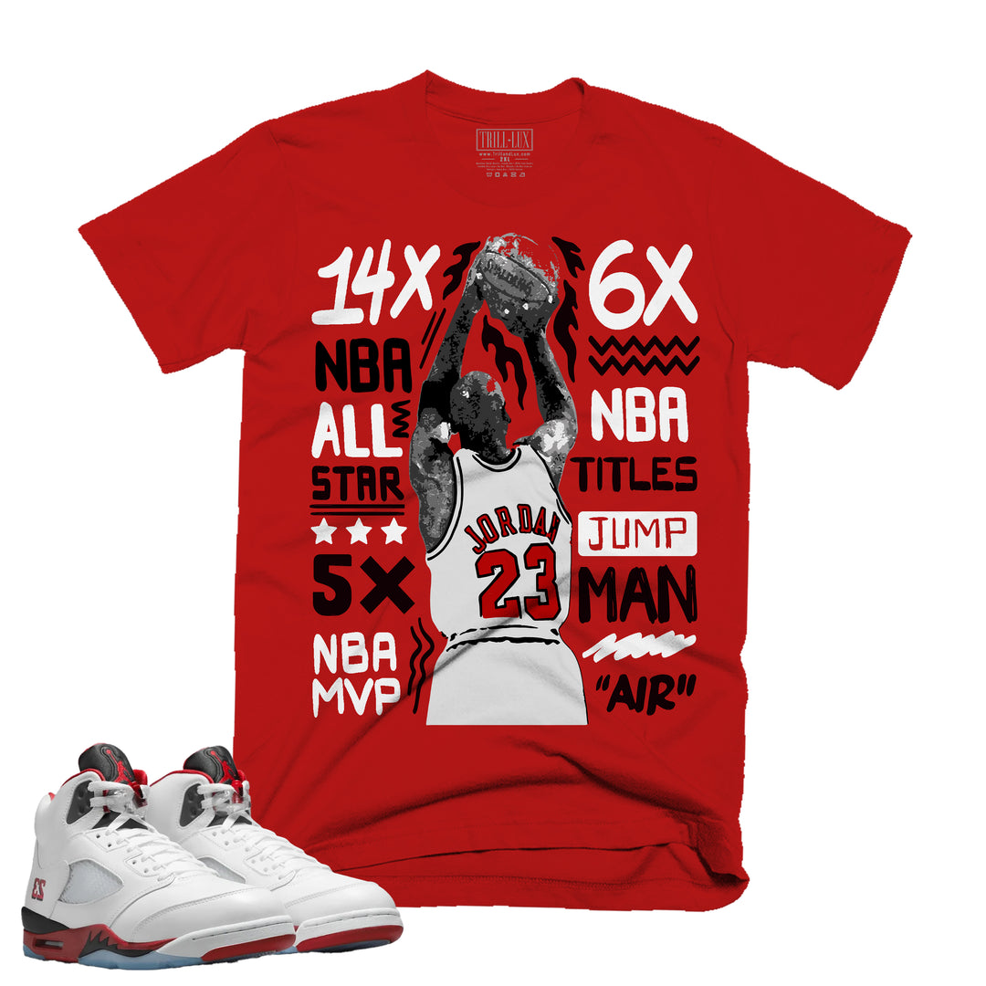 Red t-shirt with basketball player graphic and statistics, paired with white sneakers.