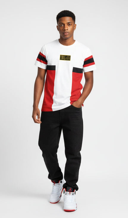 Person wearing a red, white, and black striped t-shirt with a logo on a white background