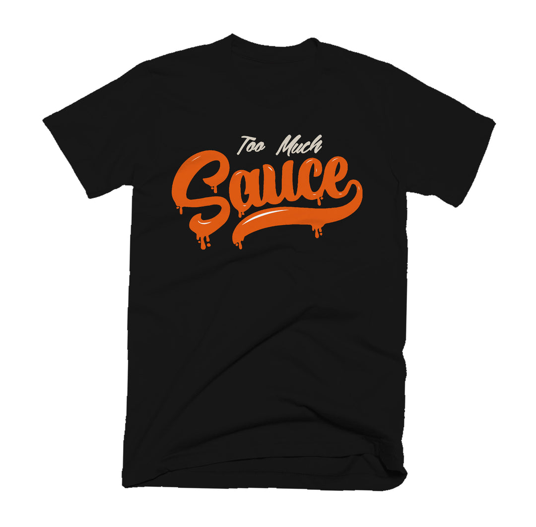 Black t-shirt with 'Too Much Sauce' text in orange and white on a white background